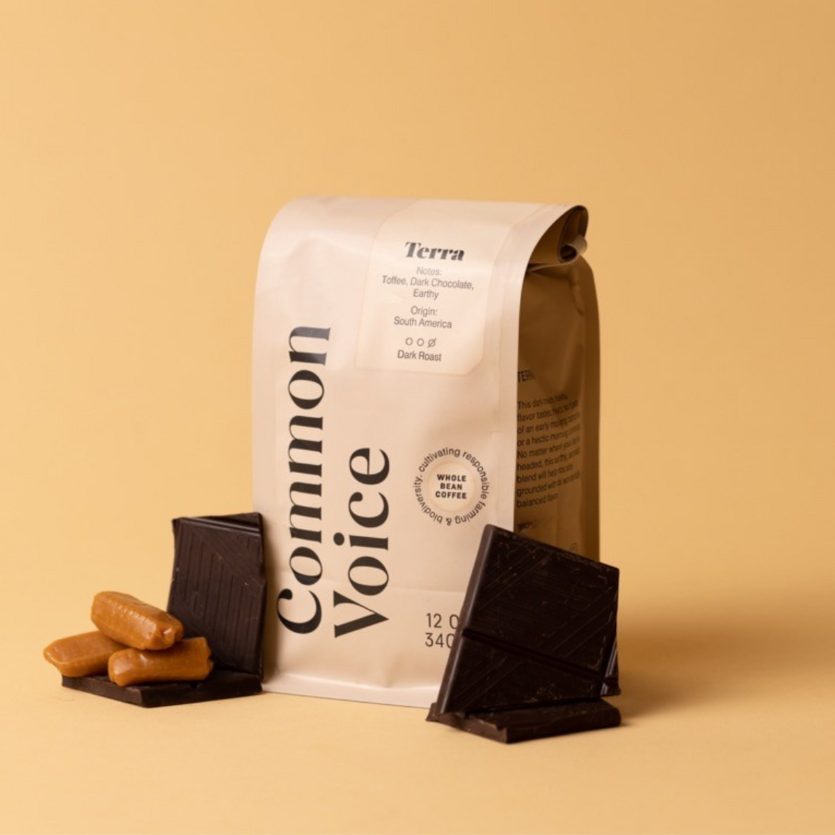 Terra coffee bag on beige background next to toffee and chocolate