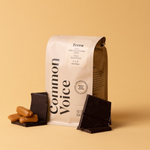 Terra coffee bag on beige background next to toffee and chocolate