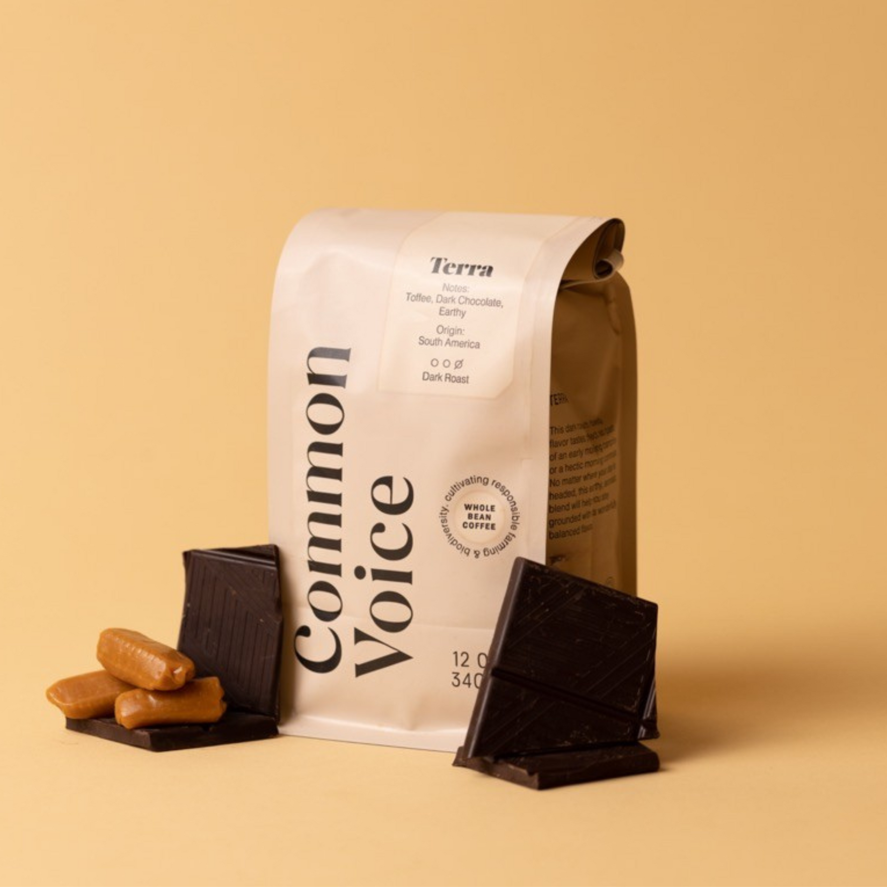 Terra coffee bag on beige background next to toffee and chocolate